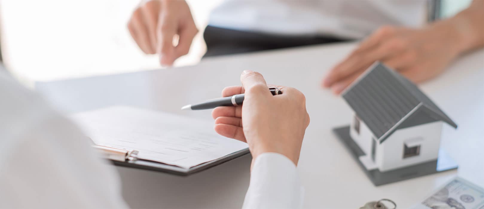 close-up of people doing paper work.